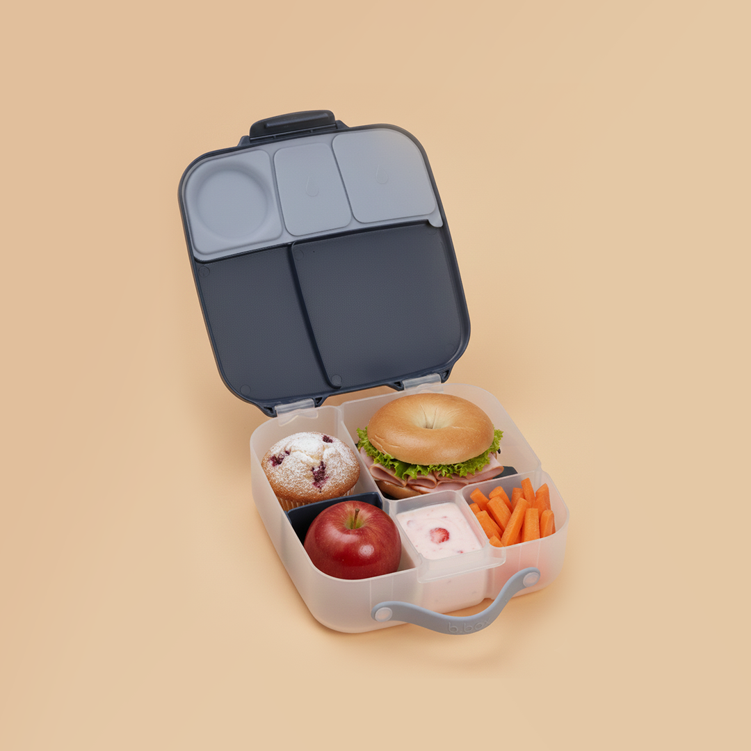 b.box lunch box lifestyle shot with 2 girls sharing what they have for lunch in their lunchboxes