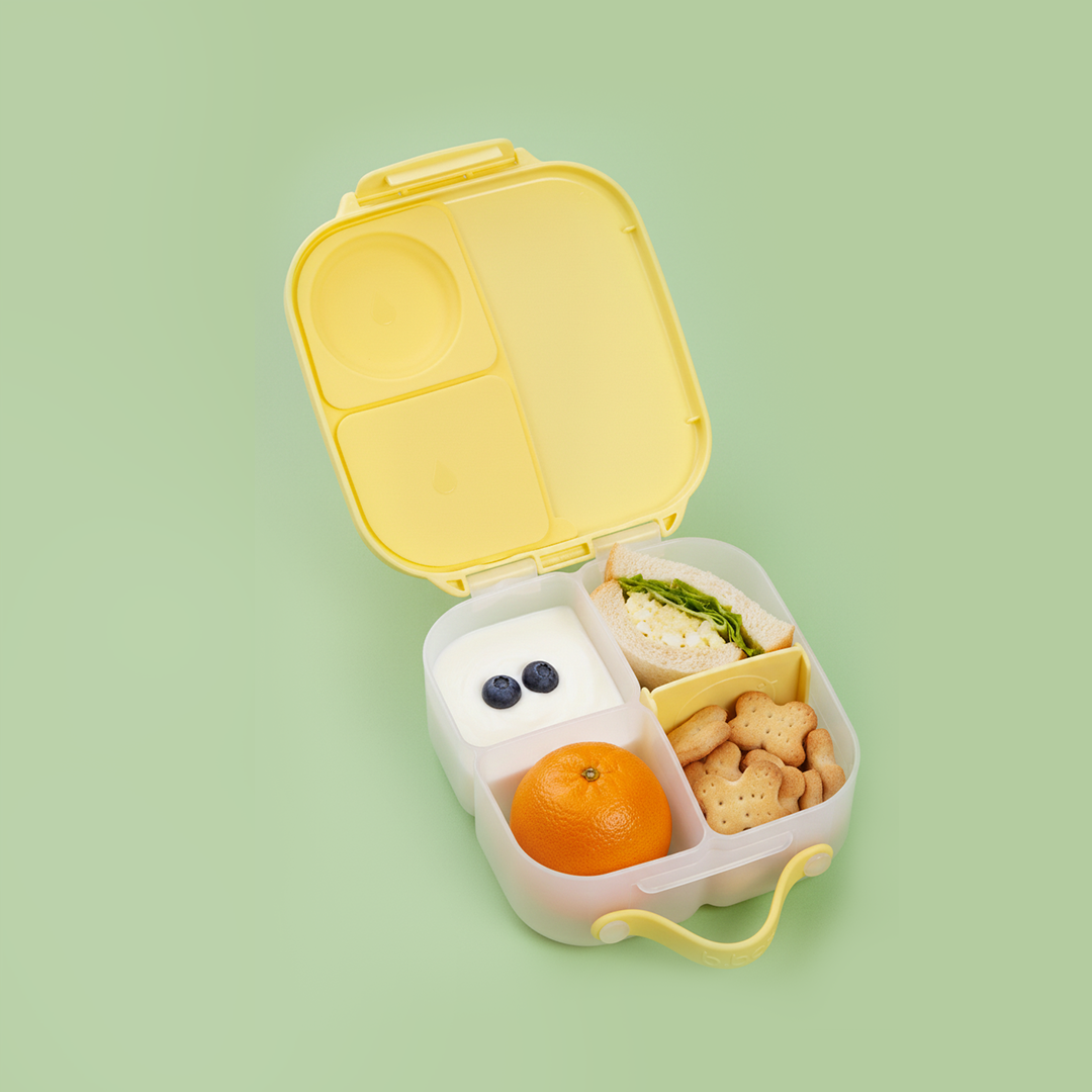 b.box mini lunch box lifestyle image with 2 girls starting to eat their food