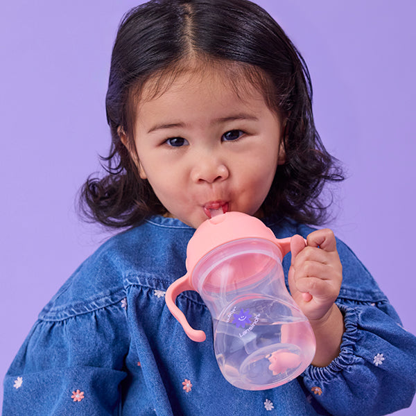 little girl drinking from a b.box + lansinoh co-branded sippy cup from their new partnership collection